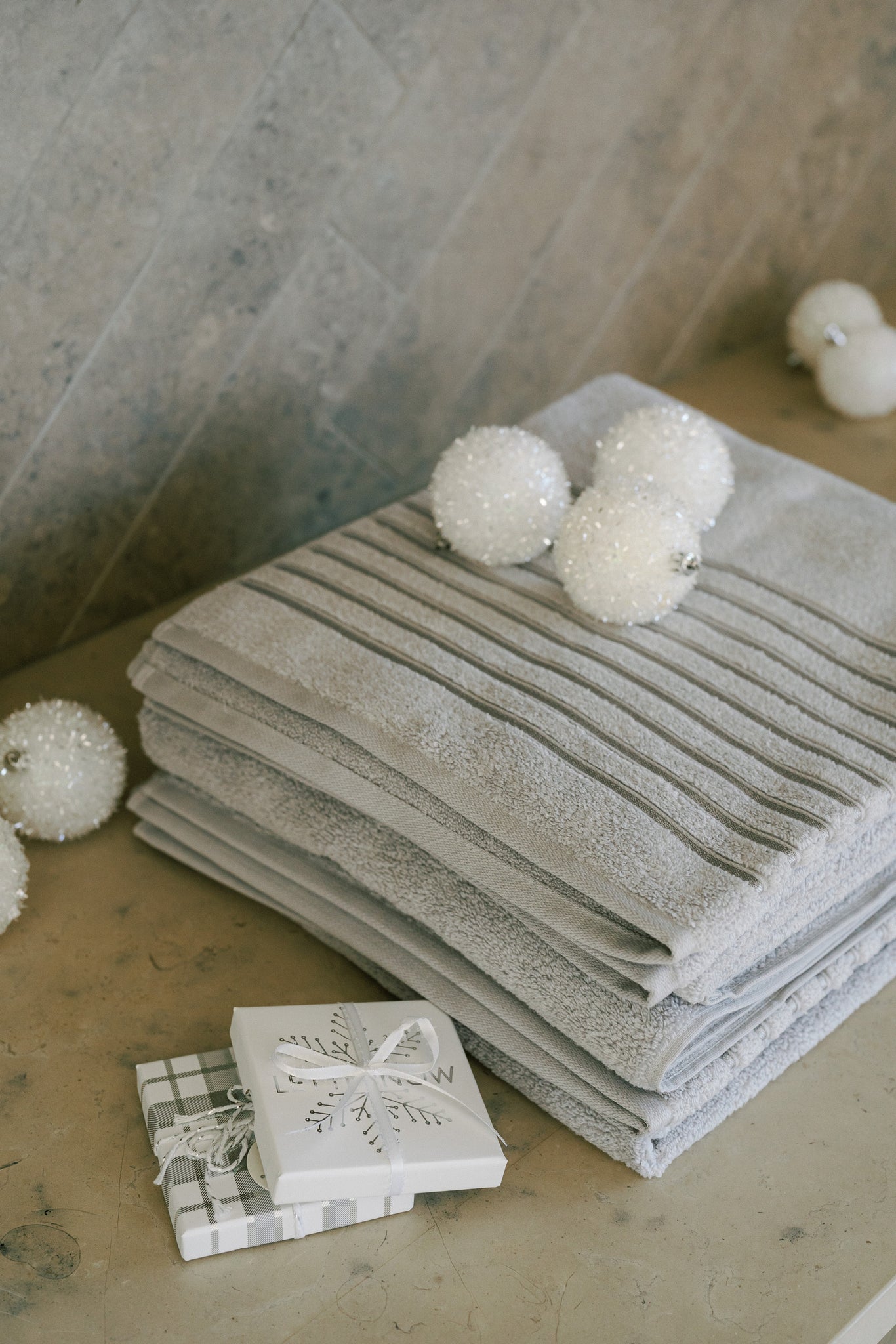 Keep them cozy with a basket of fresh towels, robes, and throw blankets